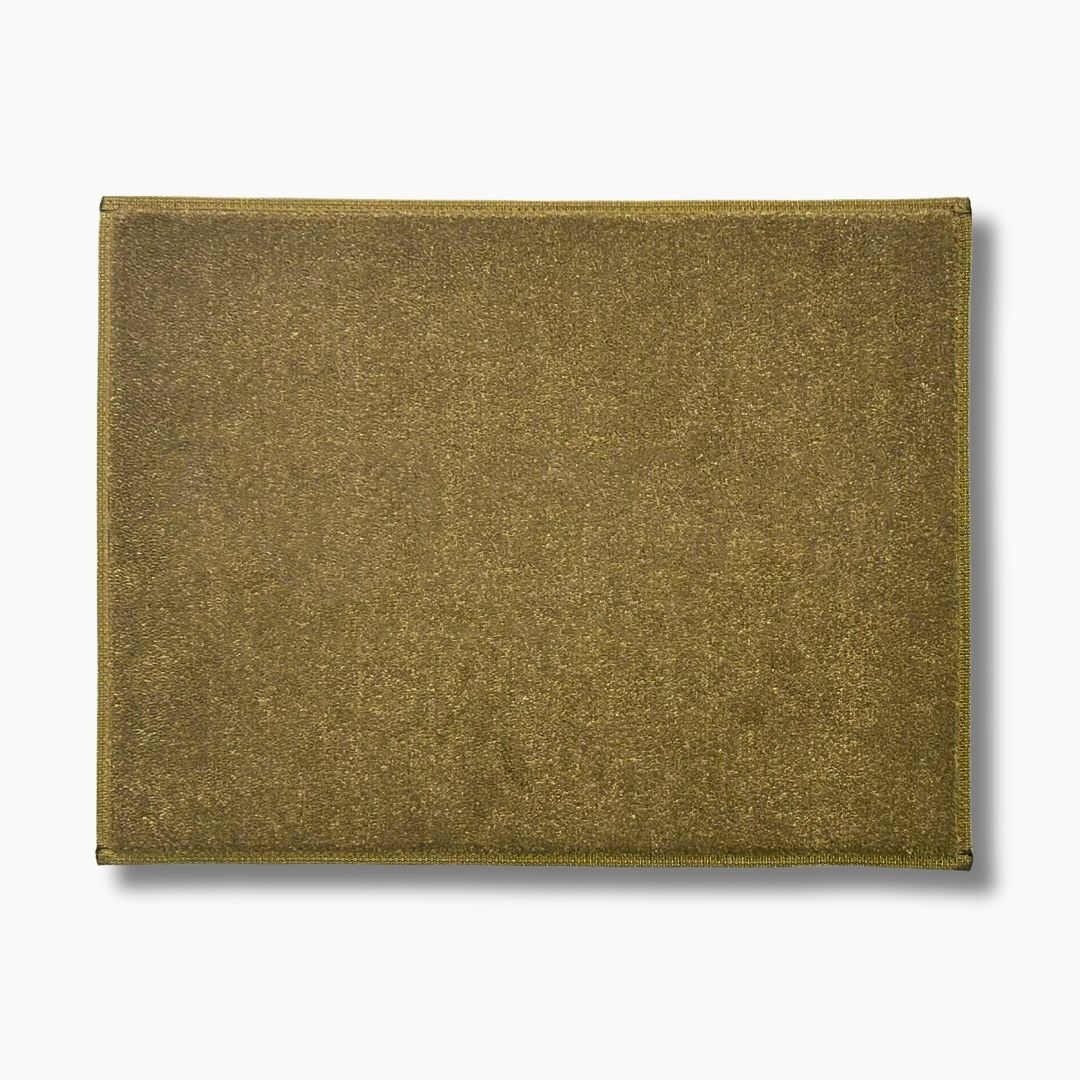 A rectangular tan custom embroidered carpet boat mat