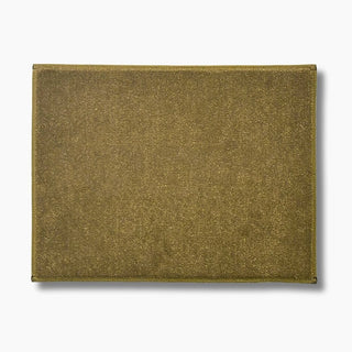 A rectangular tan custom embroidered carpet boat mat