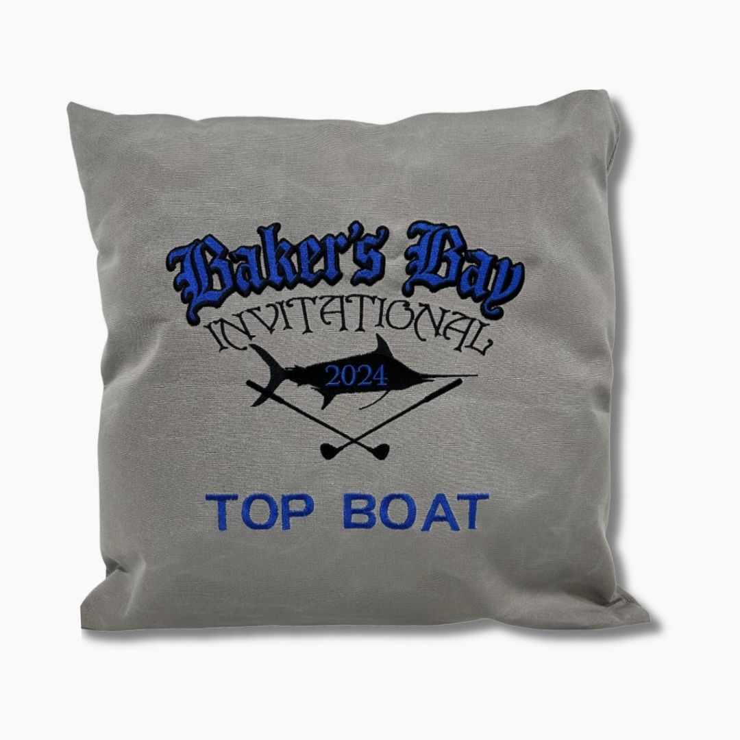 Gray sunbrella weighted boat pillow with 'Baker's Bay Invitational 2024 Top Boat' text and graphics 