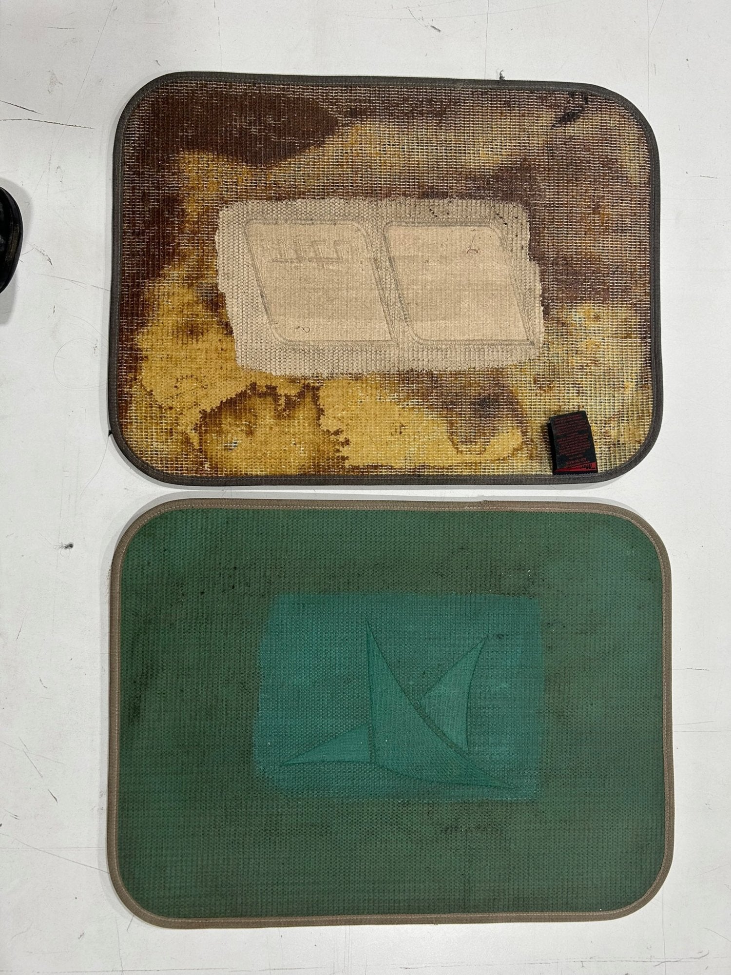 Competitor mat with completely deteriorated backing on top vs BoatMat with intact backing on bottom