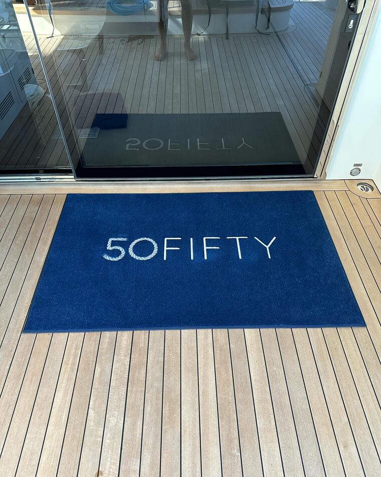 Custom yacht mat reading 50FIFTY with nautical rope lettering detail