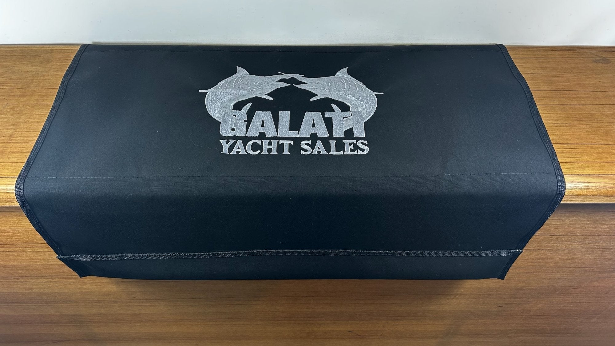 Custom embroidered Galati Yacht Sales logo on a BoatMat Sunbrella boarding mat